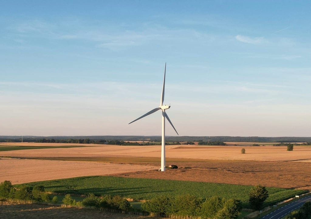 A windmill in a field.